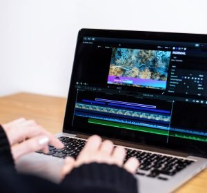 young-content-creator-girl-editing-video-her-laptop-working-from-home-scaled.jpg